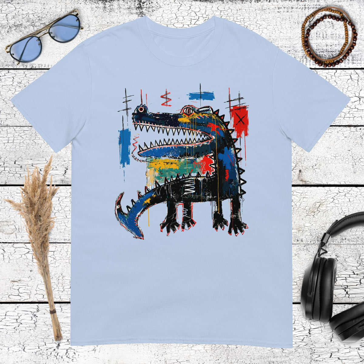 Colourful neo-expressionist crocodile graphic printed on a light blue t-shirt