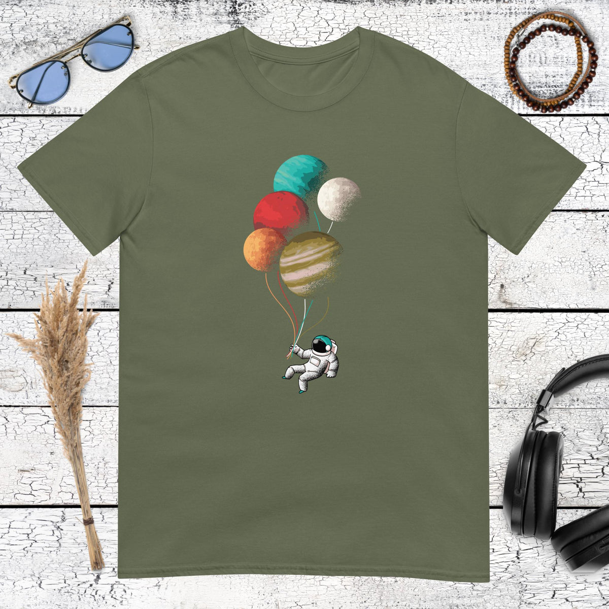 Retro style floating astronaut with planet balloons on military green shirt