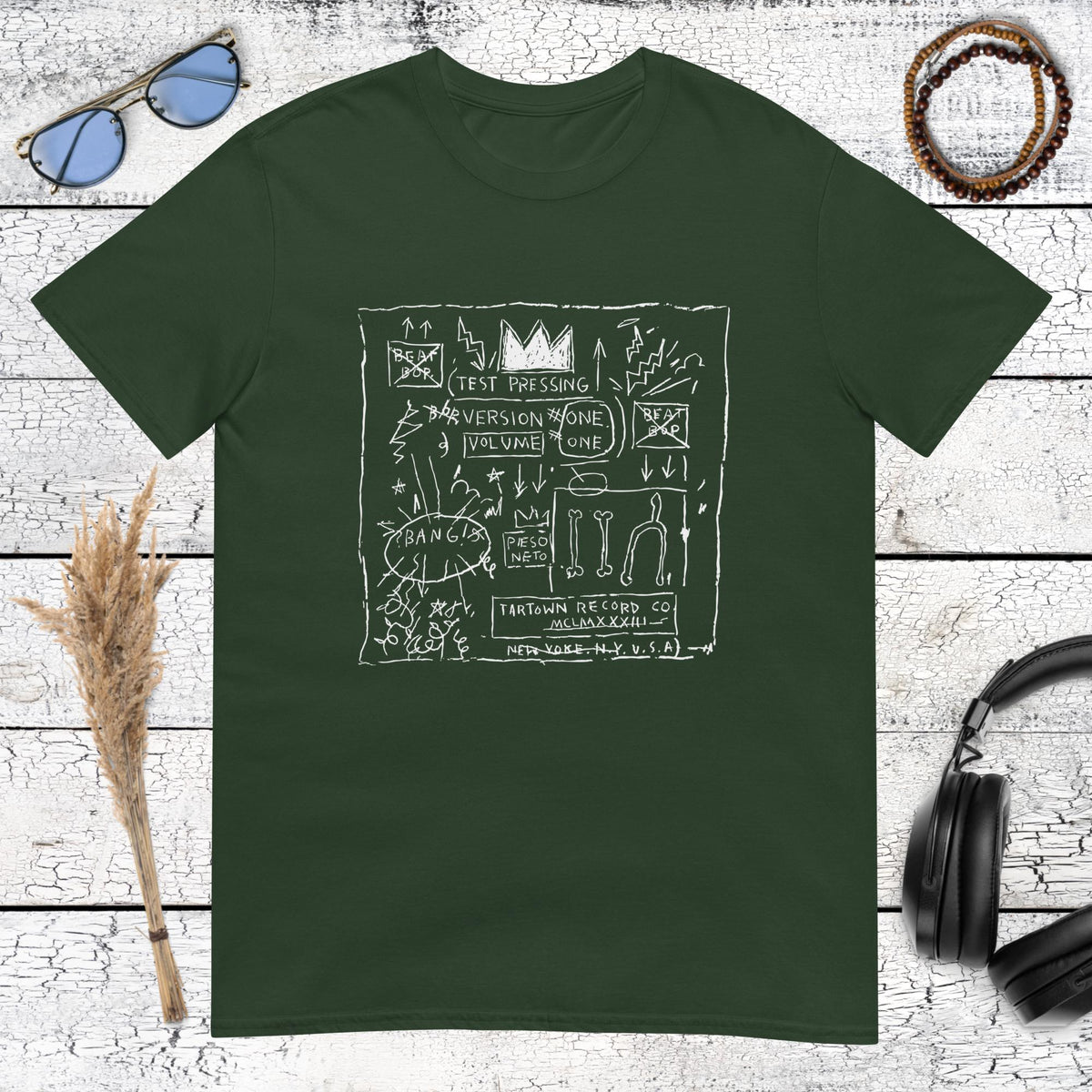 forest green t-shirt featuring a Basquiat-style sketchbook doodle graphic