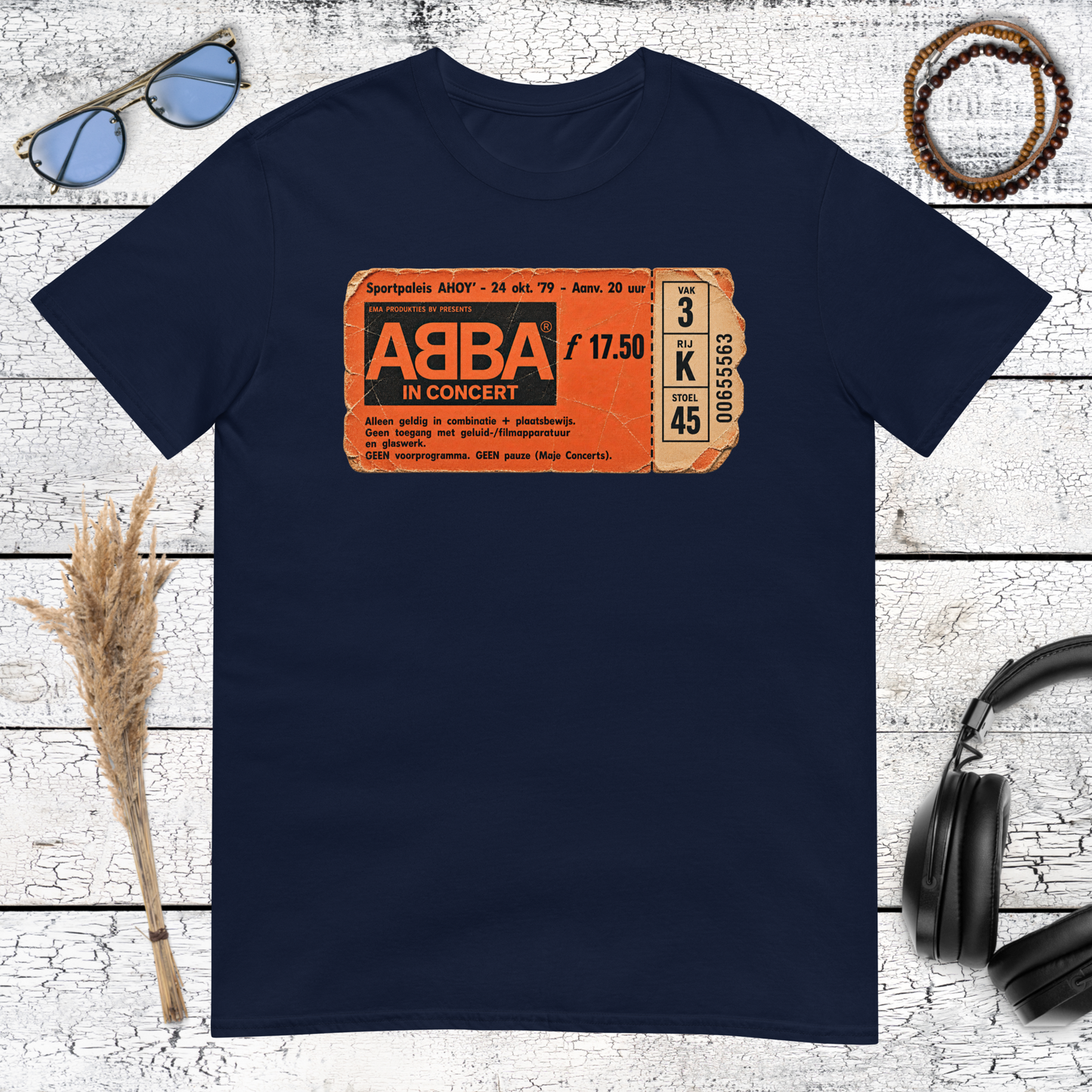 Vintage orange ABBA music graphic printed on a navy blue t-shirt