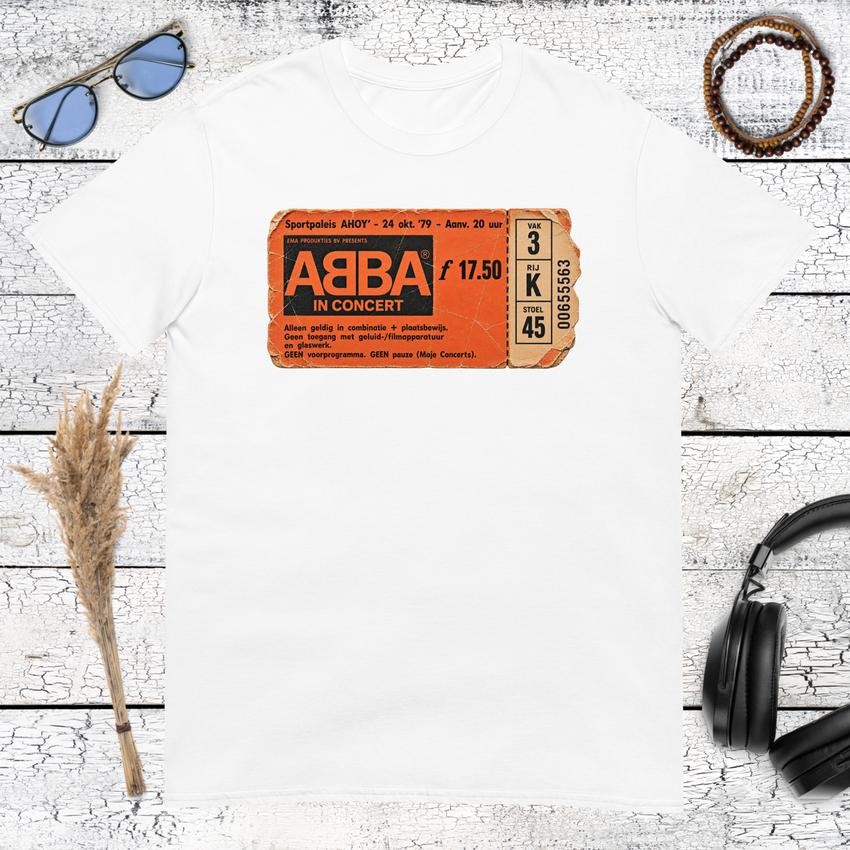 Retro orange ABBA logo graphic printed on a white t-shirt