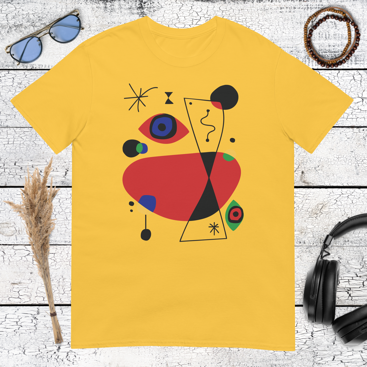 Colourful geometric abstract art graphic printed on a daisy yellow t-shirt