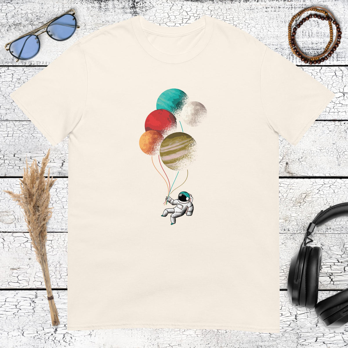 Minimalist astronaut floating with colorful planet balloons on natural tee