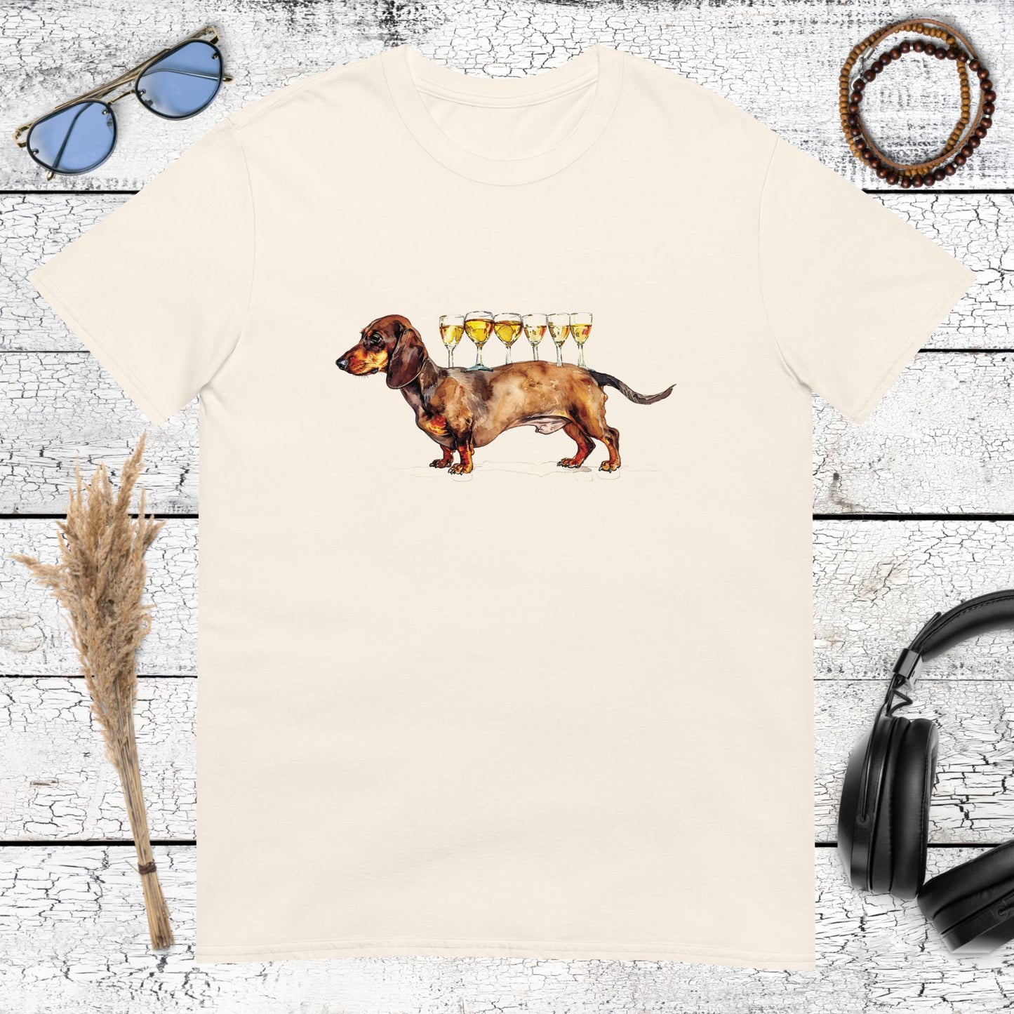 Product mockuMinimalist and chic dachshund graphic with champagne glasses printed on a natural cotton t-shirtp