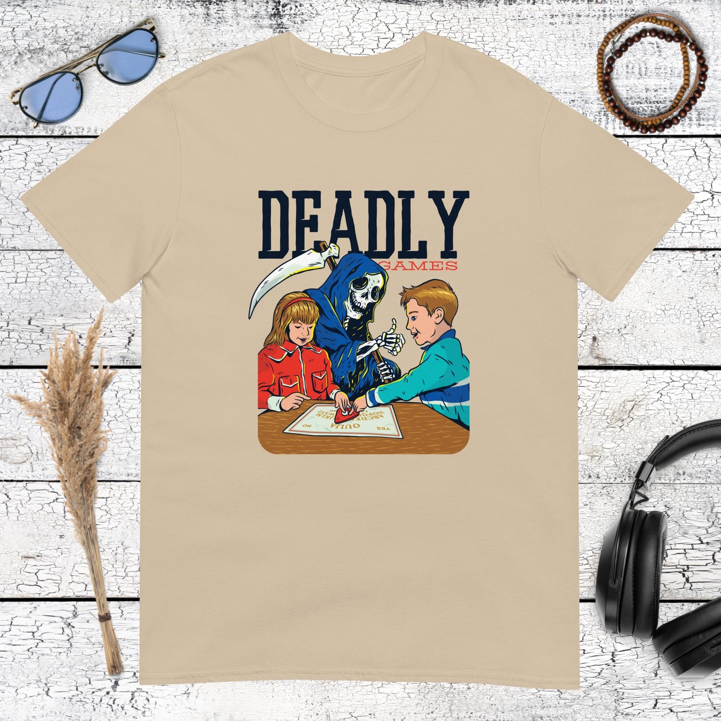 Retro typography and gaming illustration with a humorous reaper on a sand coloured t-shirt