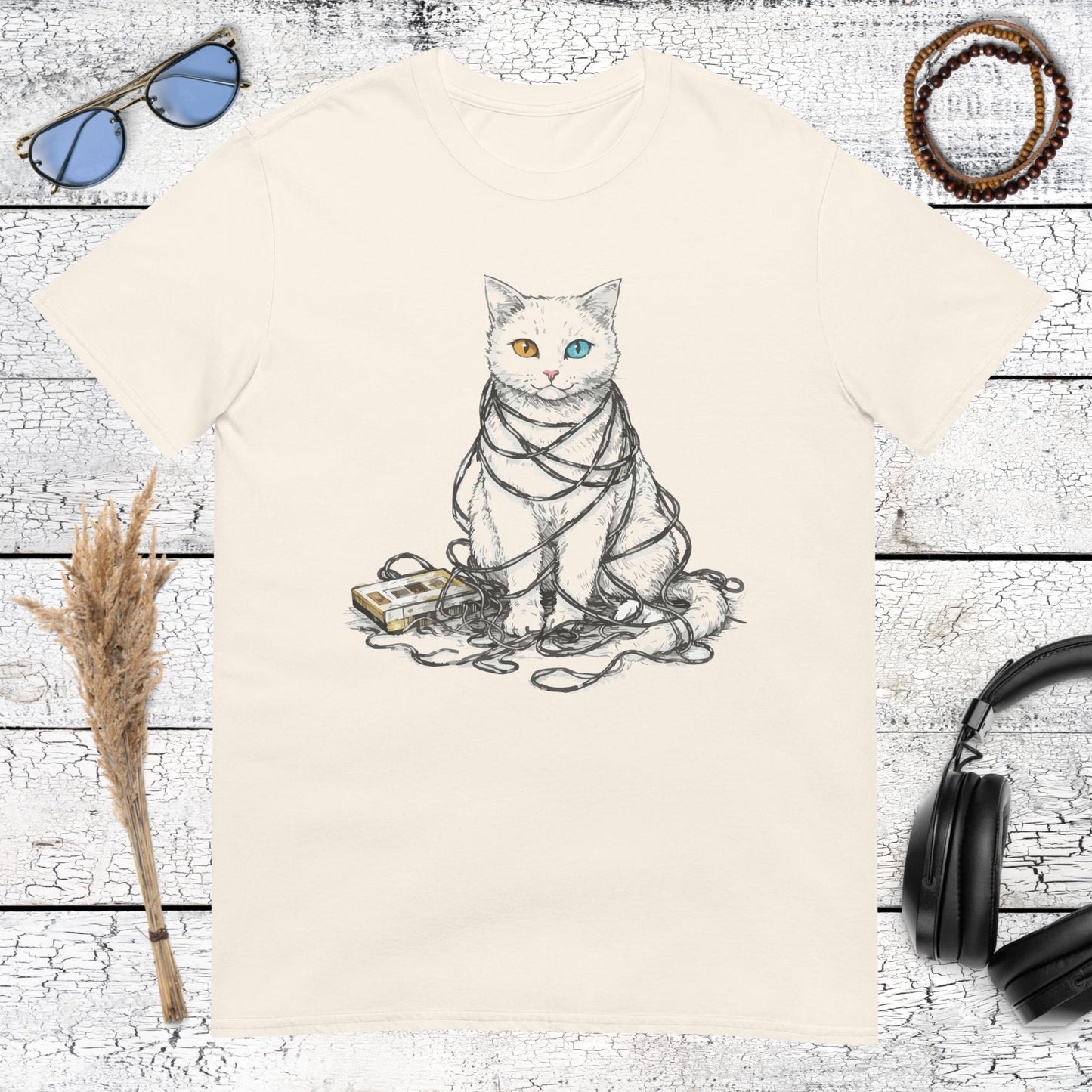 Vintage style illustration of a musical cat with headphones printed on a natural cotton t-shirt