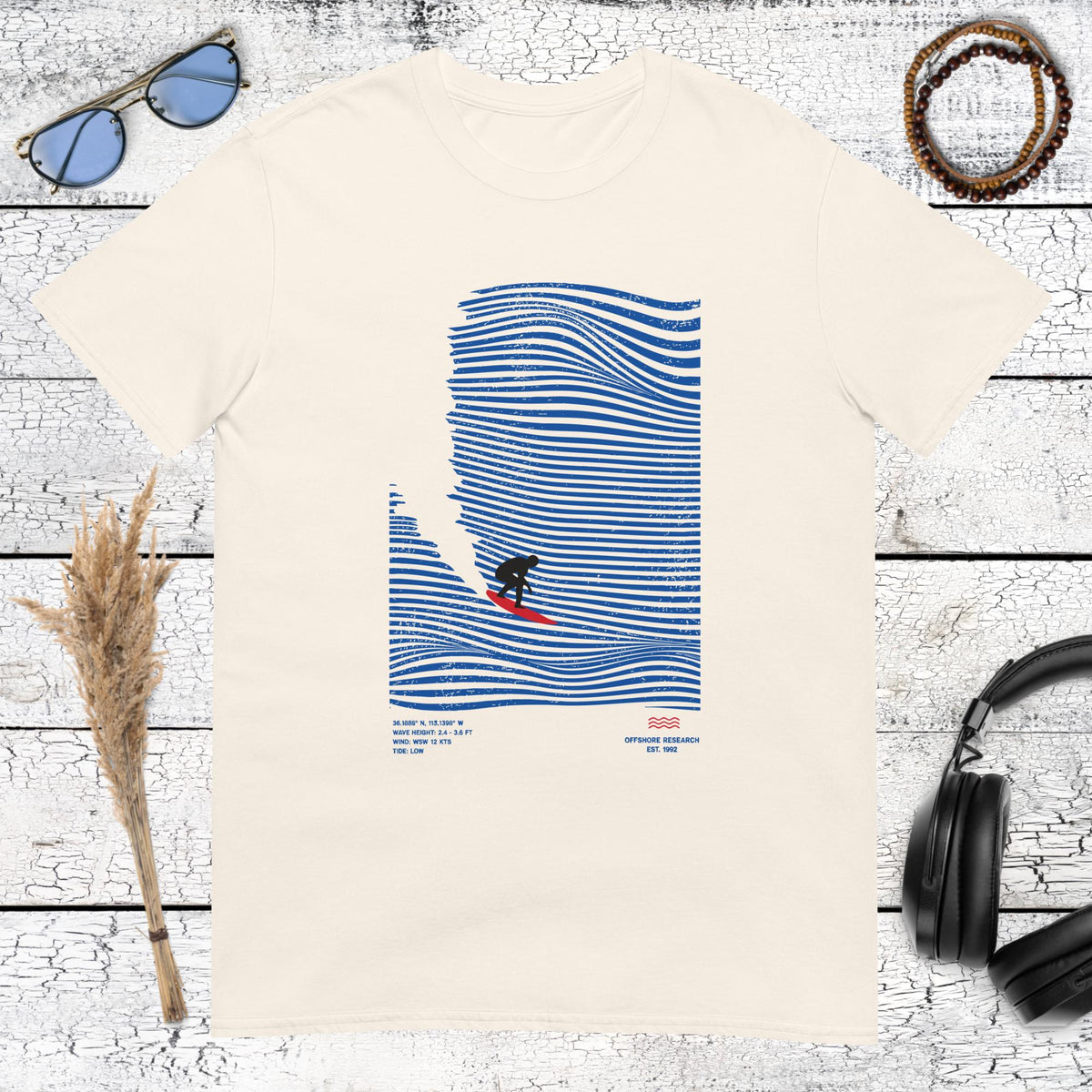 Minimalist blue line art surf illustration on a natural beige tee