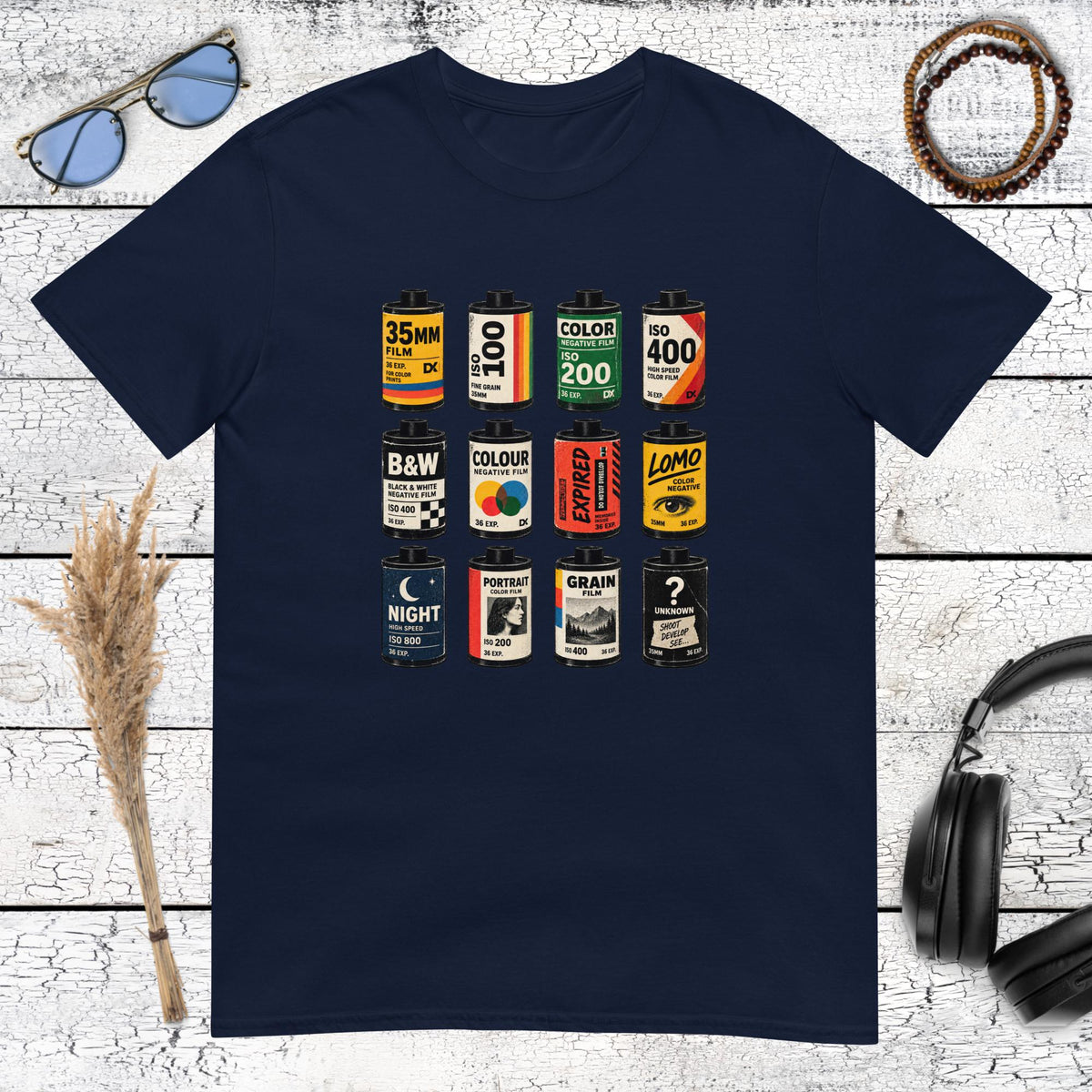 Retro photography film canister graphic printed on a navy blue t-shirt