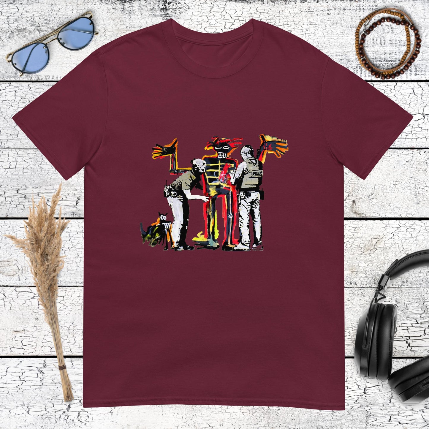 Colourful Banksy and Basquiat-inspired artwork printed on a maroon t-shirt