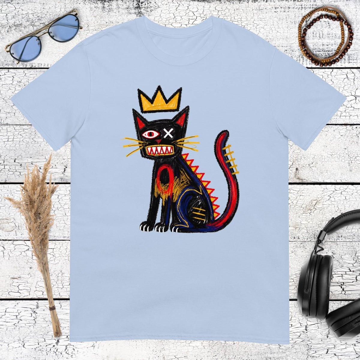 Crowned cat street art artwork printed on a light blue t-shirt