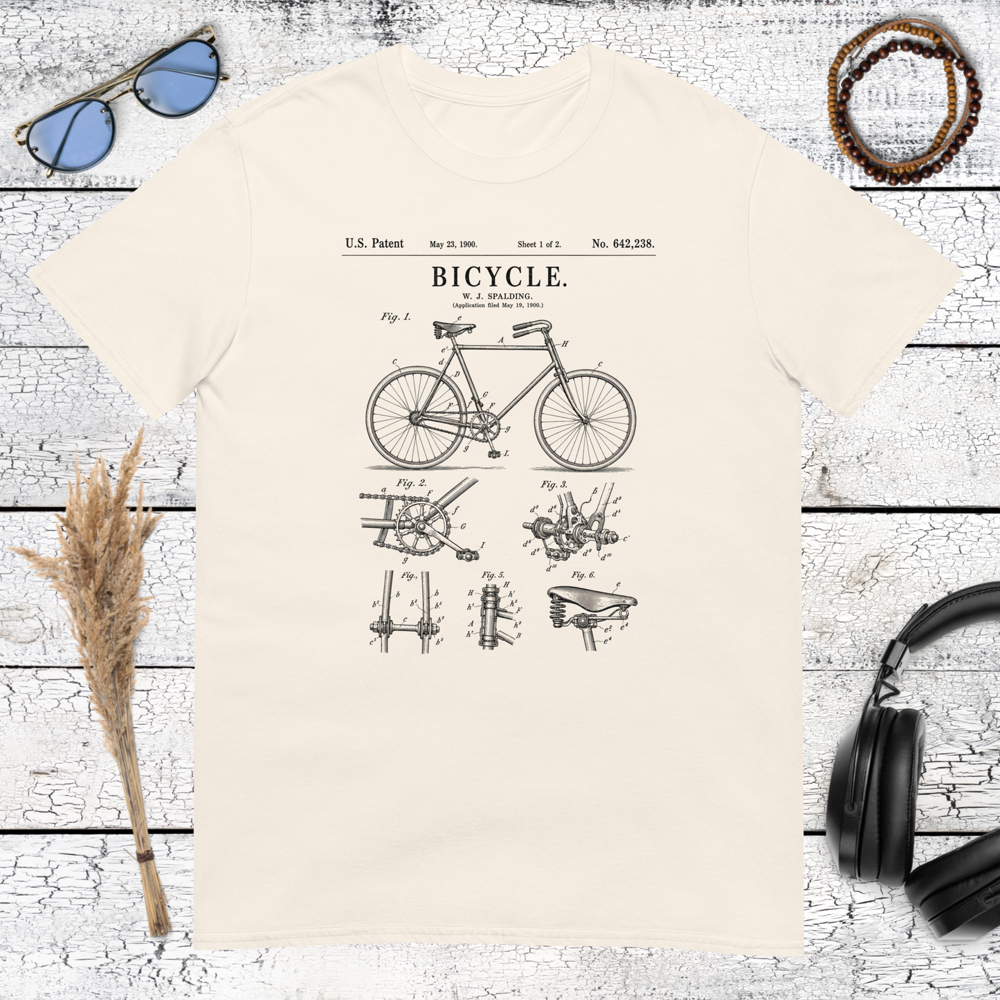 Nostalgic bicycle illustration with retro design details printed on a natural cotton t-shirt