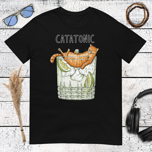 Funny orange cat holding a cocktail glass with Catatonic lettering on a black t-shirt