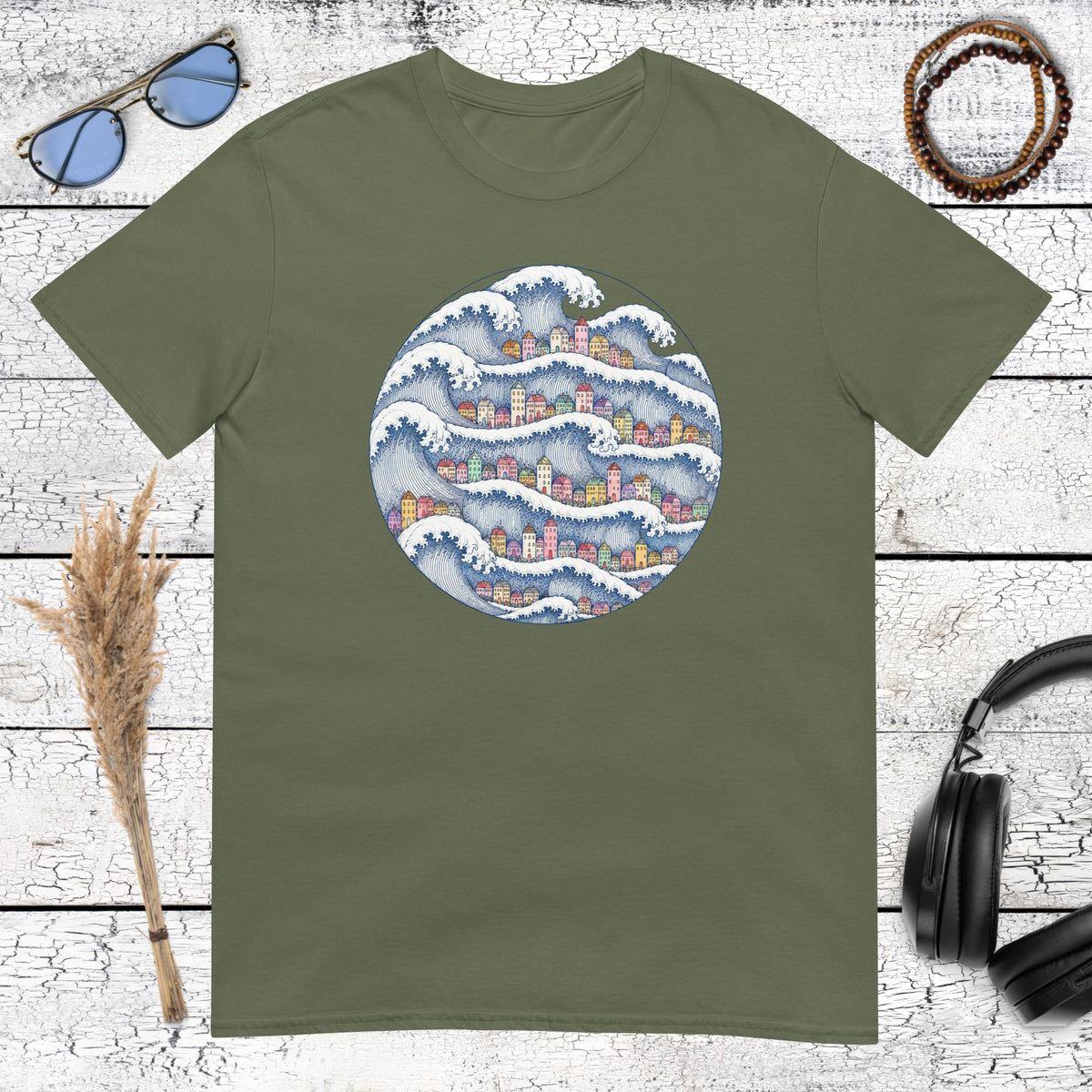 Japanese-inspired wave and coastal village graphic printed on a military green t-shirt