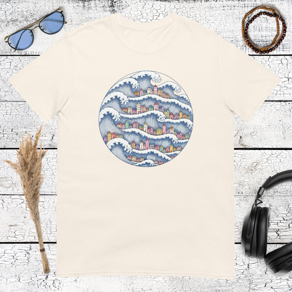 Japanese-inspired wave and coastal village artwork printed on a natural cotton t-shirt