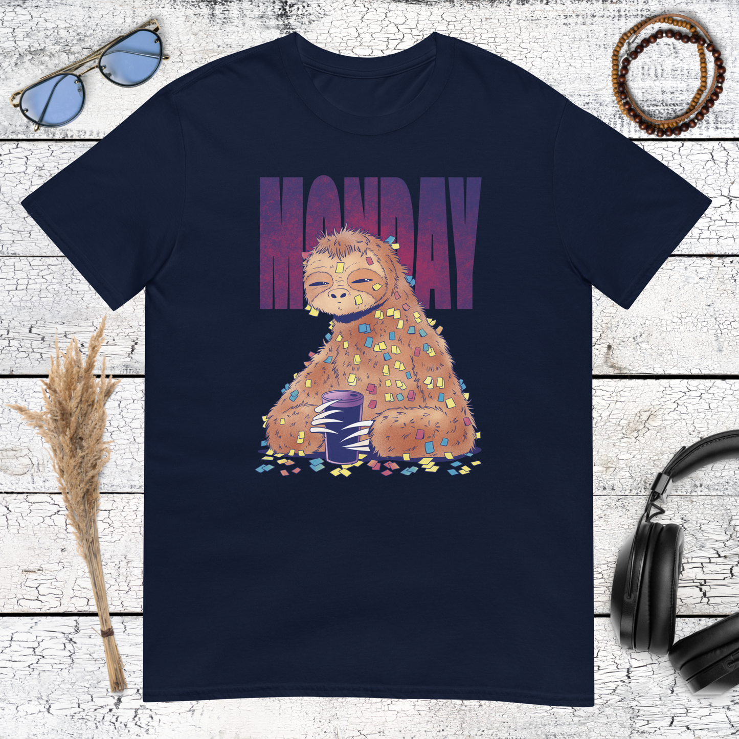 Detailed sloth character holding coffee with purple Monday lettering on a navy blue t-shirt