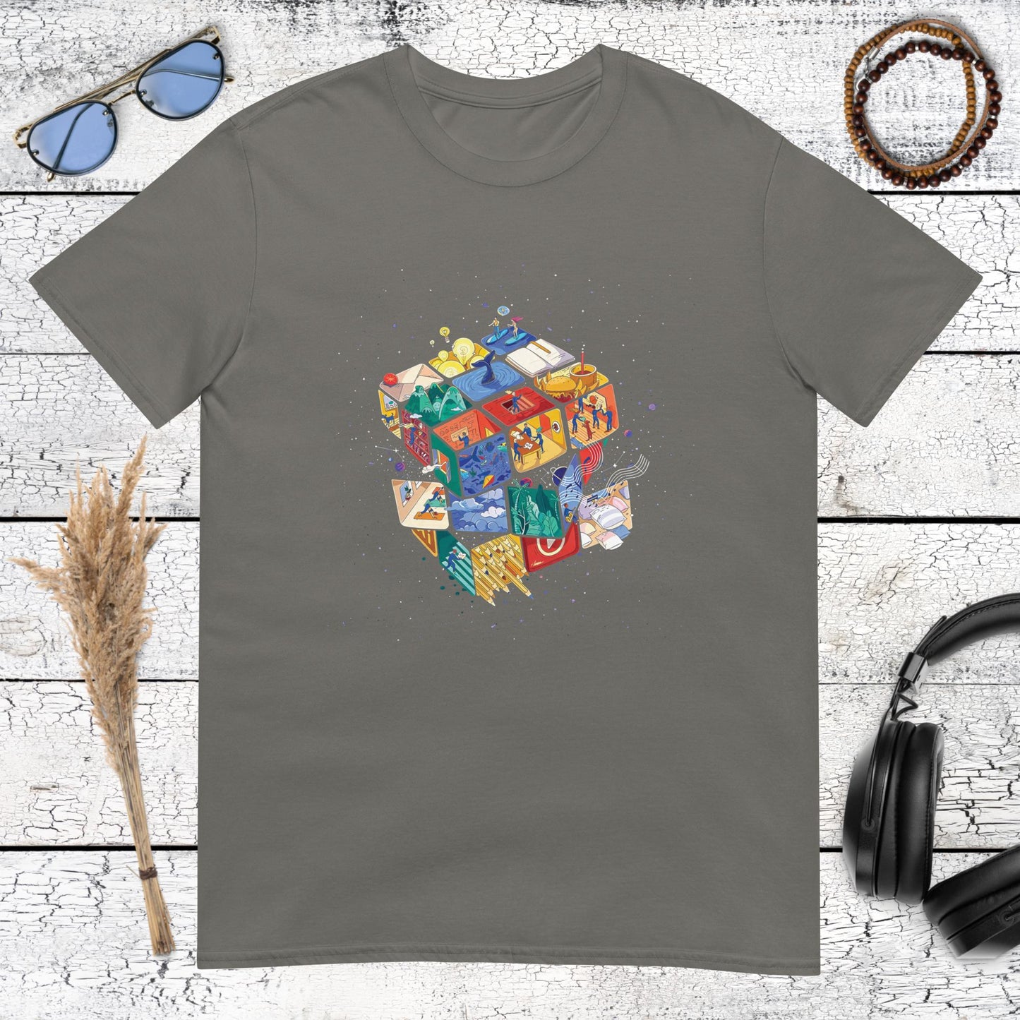 Surrealist space puzzle graphic featuring a galaxy cube on a charcoal t-shirt