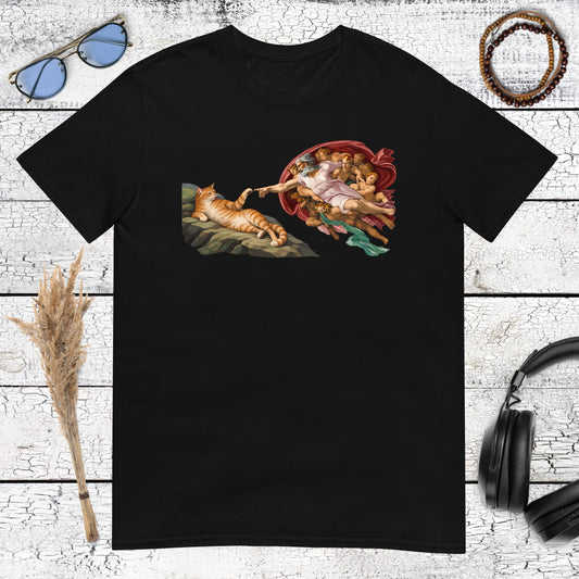Humorous Creation of the Cat artwork with orange tabby and reaching hands printed on a black tshirt