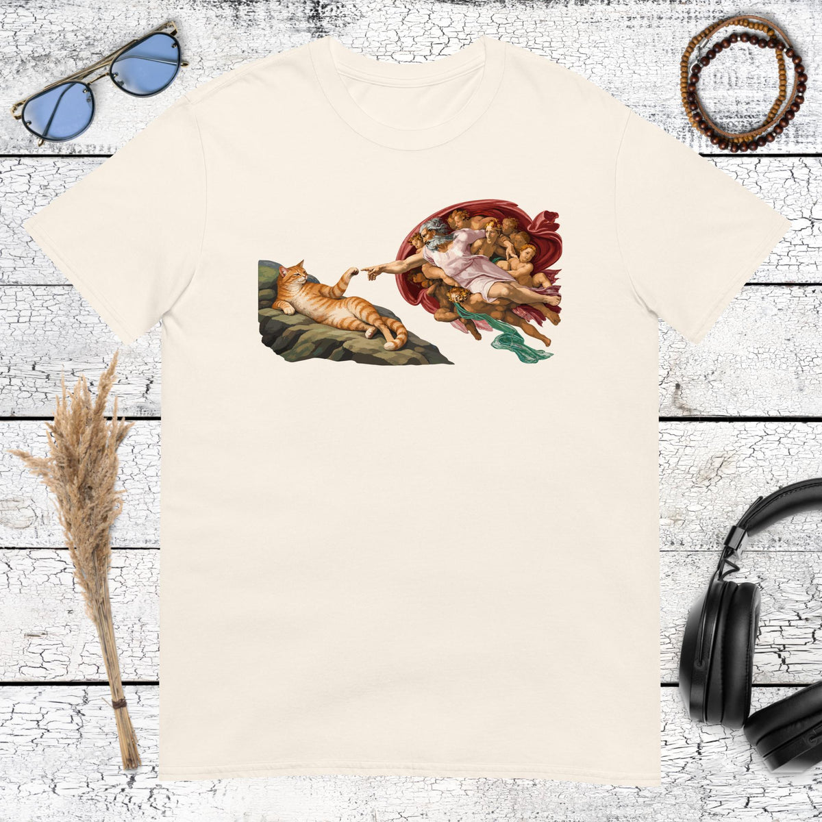Famous Renaissance art parody featuring an orange tabby cat printed on a natural cotton tshirt