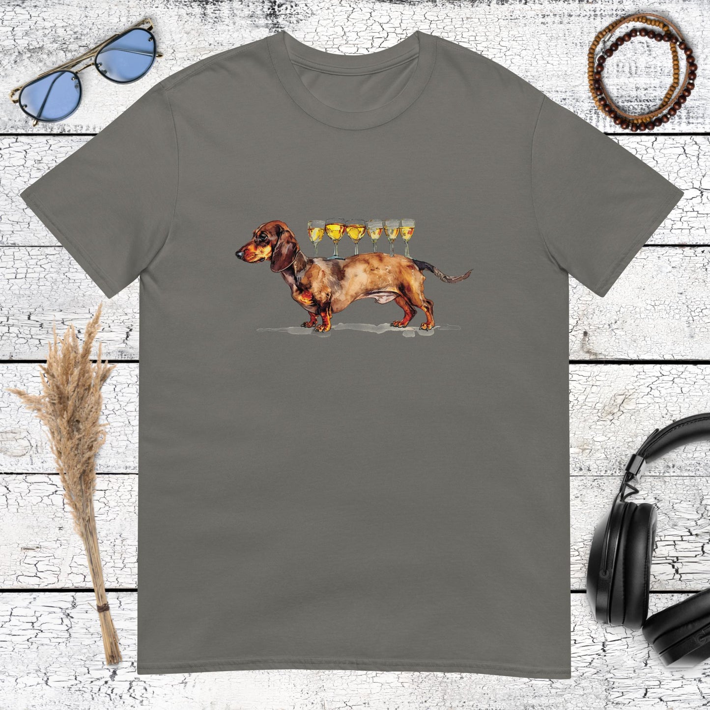 Funny dachshund illustration balancing five golden champagne glasses on its back on a charcoal t-shirt