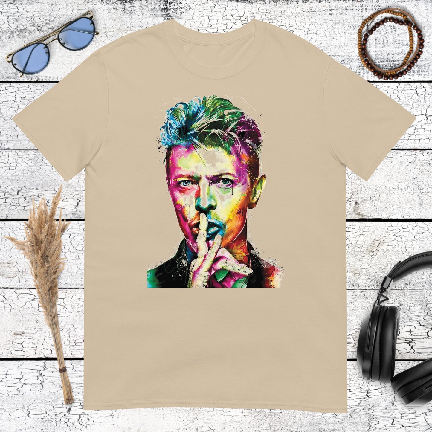 Colourful David Bowie artwork with watercolor-style details printed on a sand t-shirt