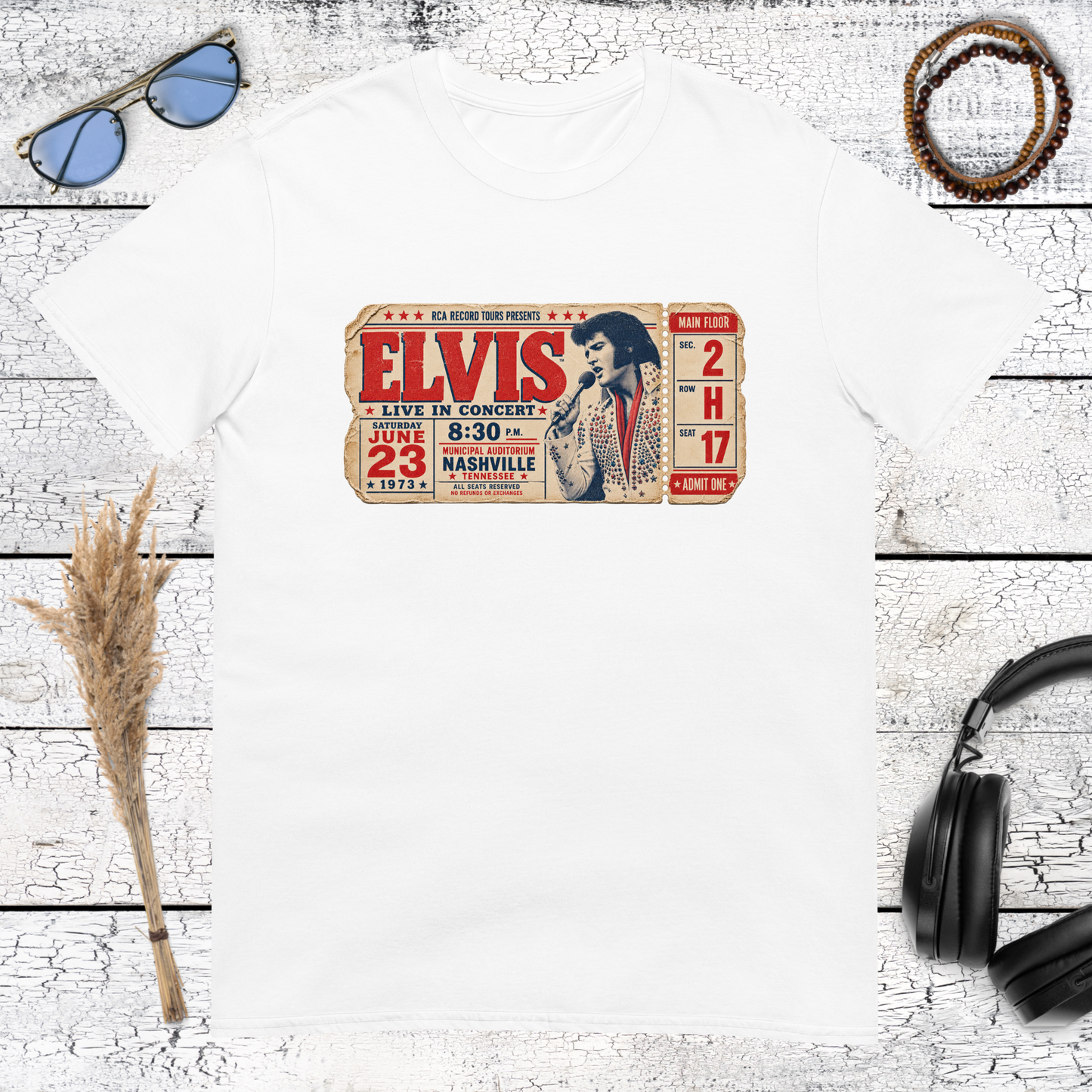 Retro Elvis concert ticket graphic with bold lettering on a white t-shirt