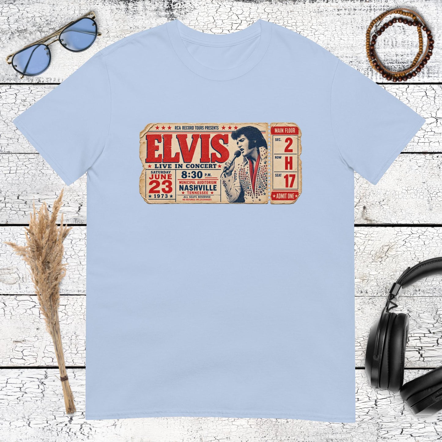 Retro Elvis music ticket graphic printed on a light blue t-shirt