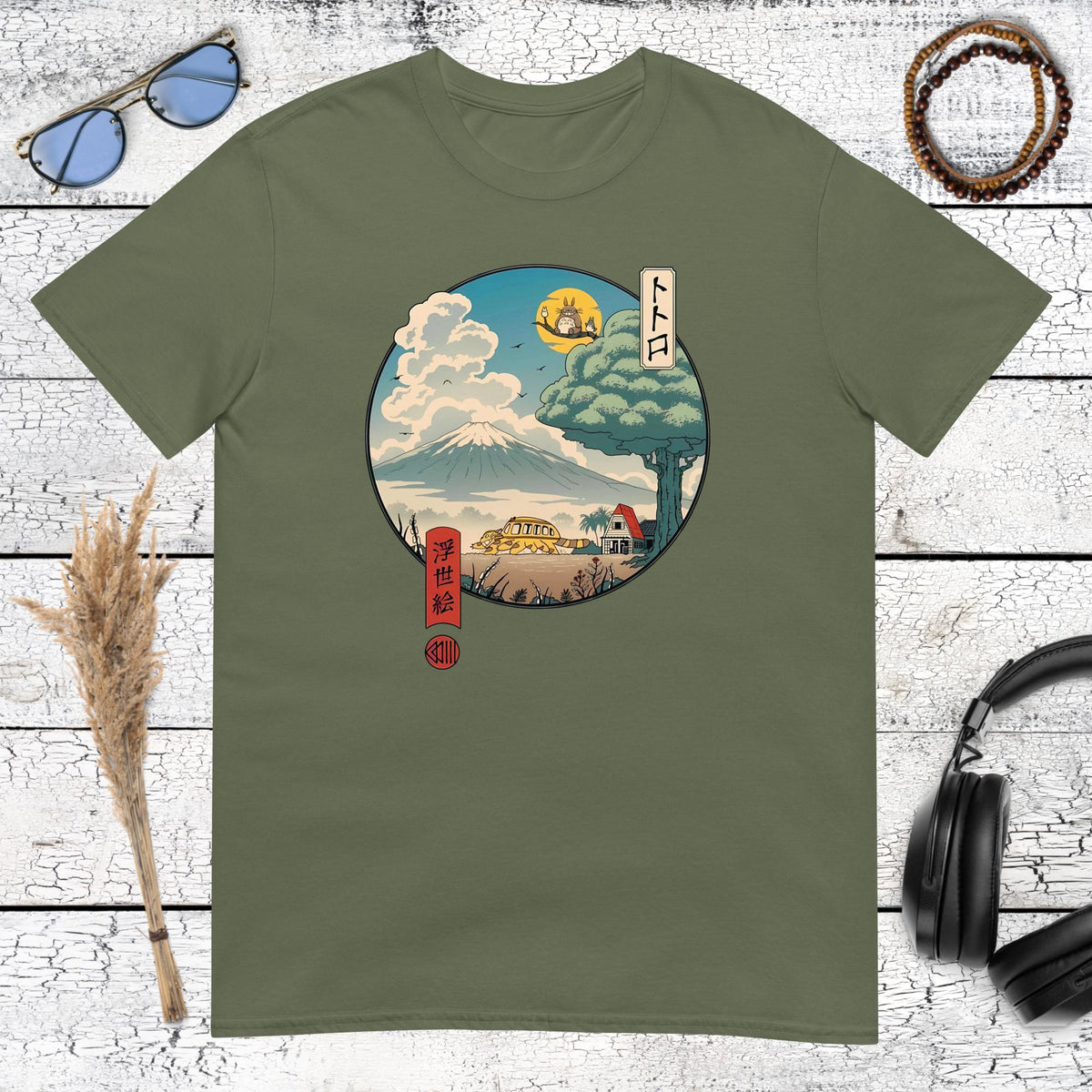 Studio Ghibli inspired nature landscape with Totoro in a circular frame on a military green t-shirt