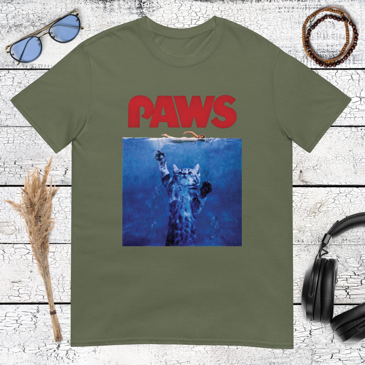 PAWS shark movie parody graphic on a military green t-shirt