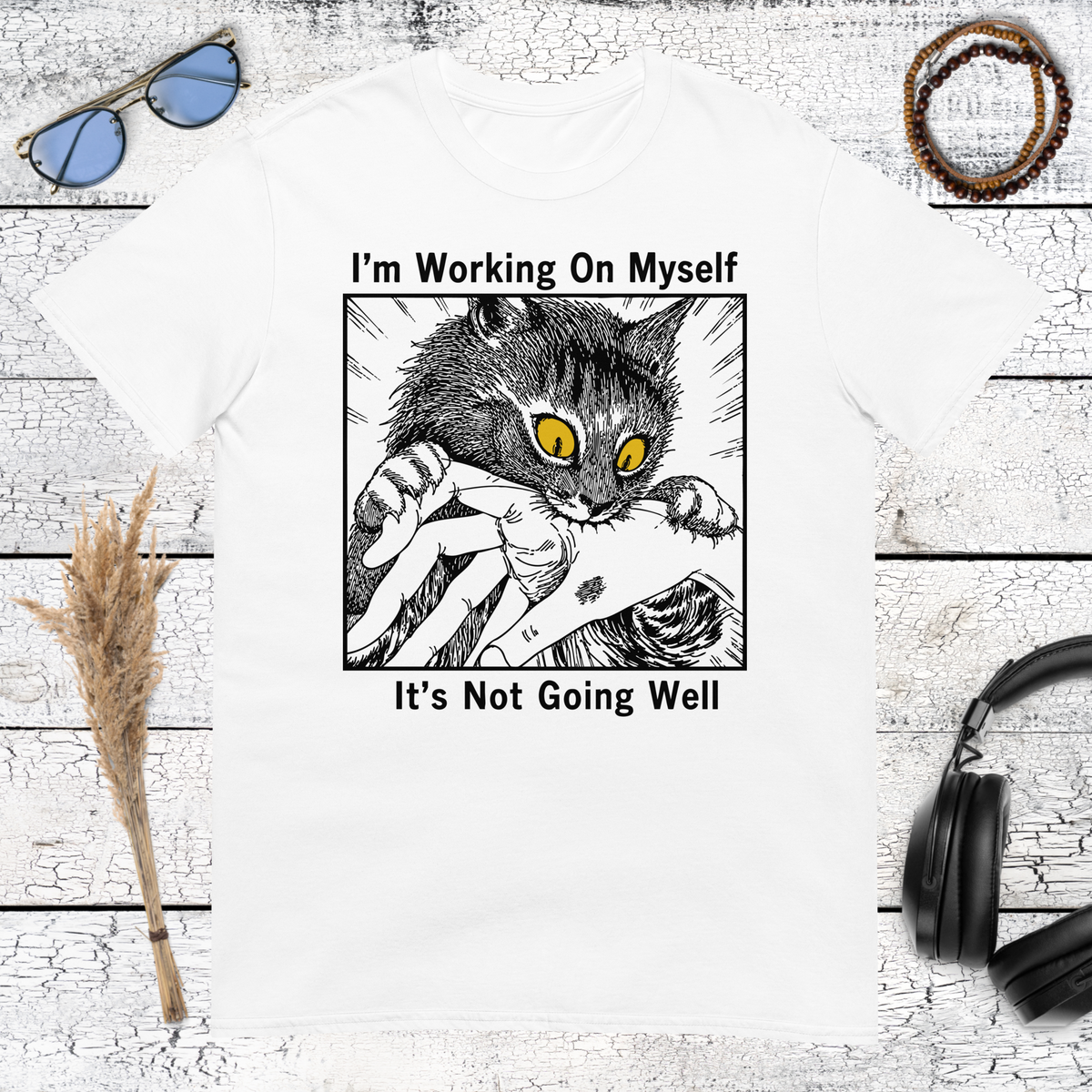 Black and white cat graphic with sarcastic quote printed on a white t-shirt