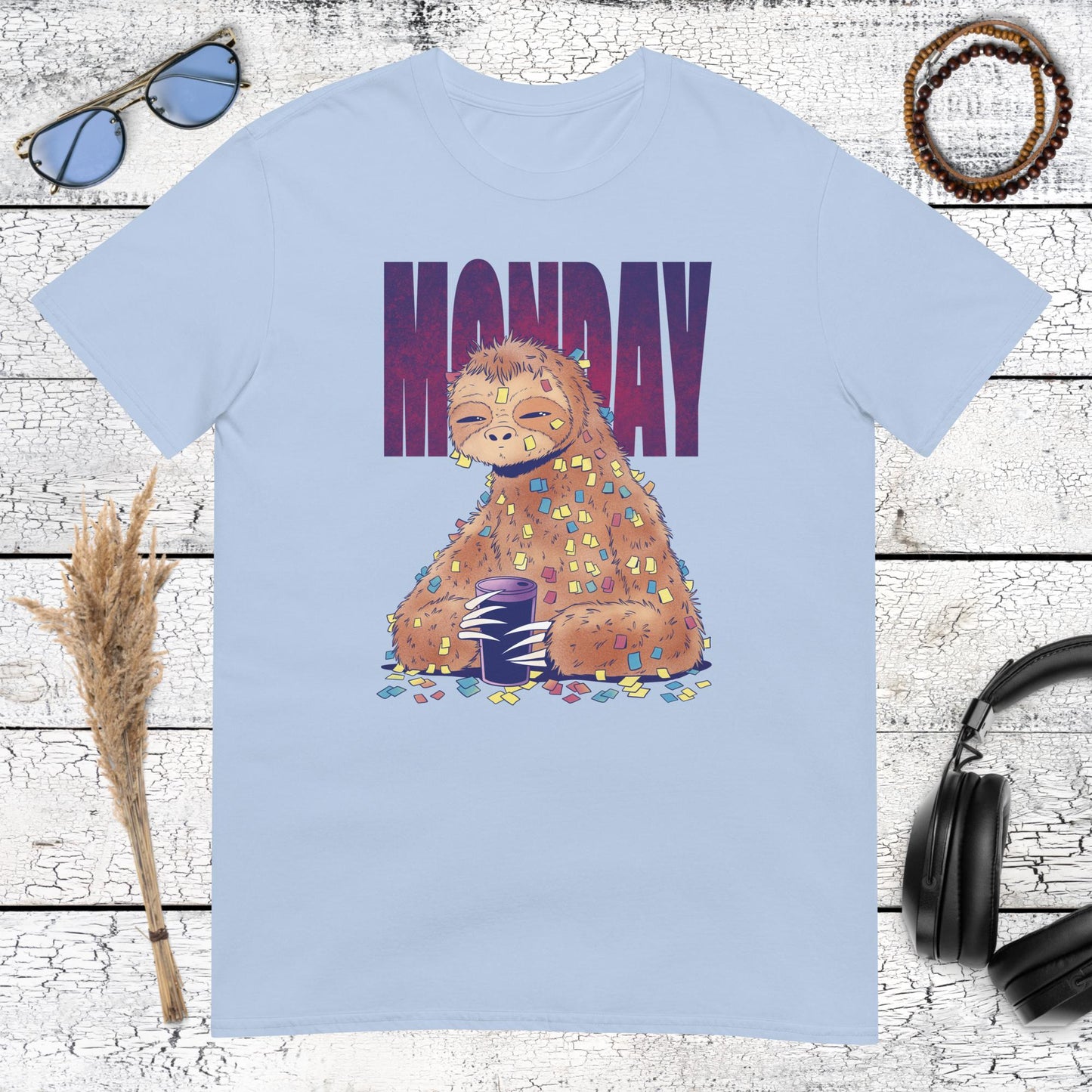 Whimsical sleepy sloth illustration for Monday mornings on a light blue t-shirt