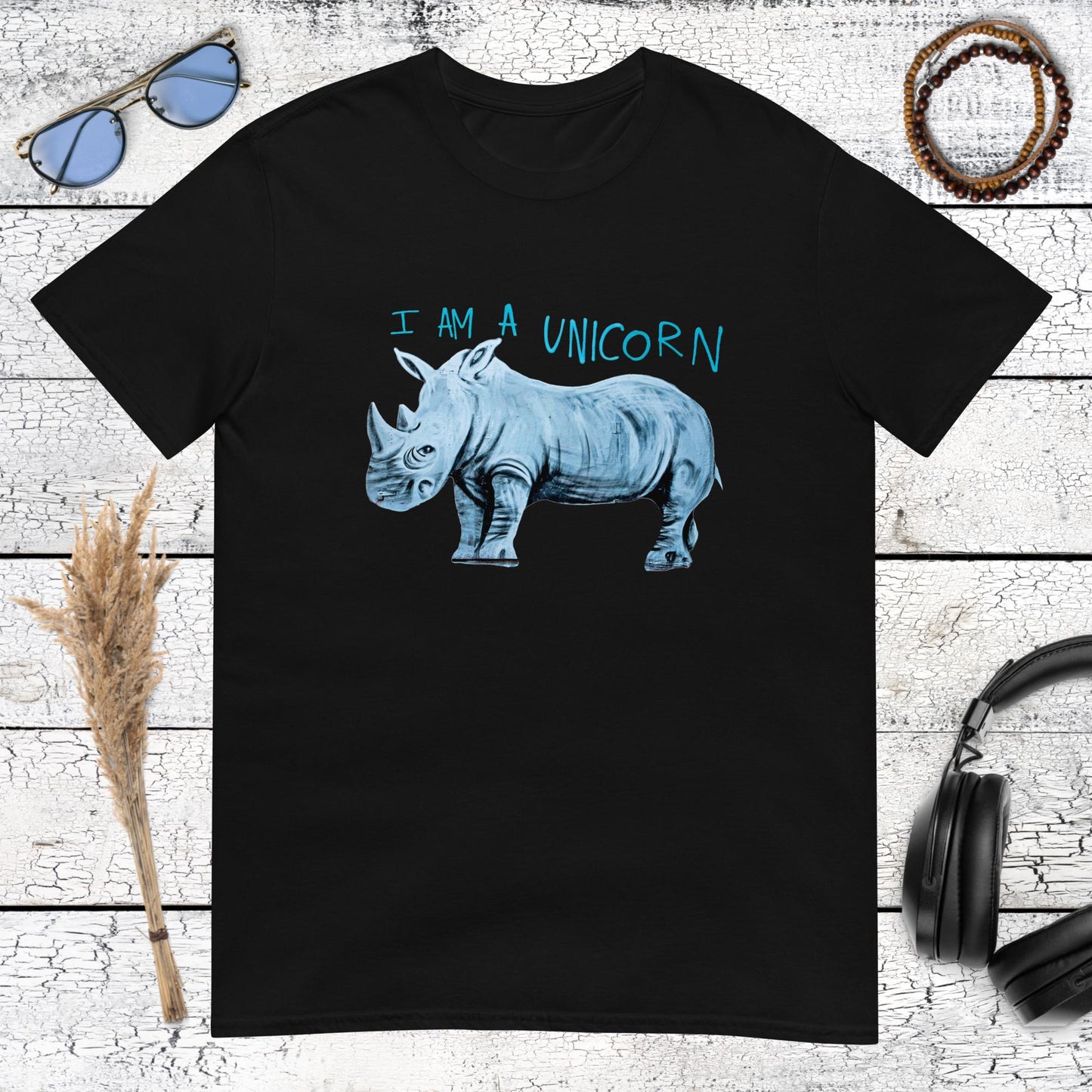 Cool rhino graphic with sarcastic "I'm a unicorn" message on a classic black t-shirt