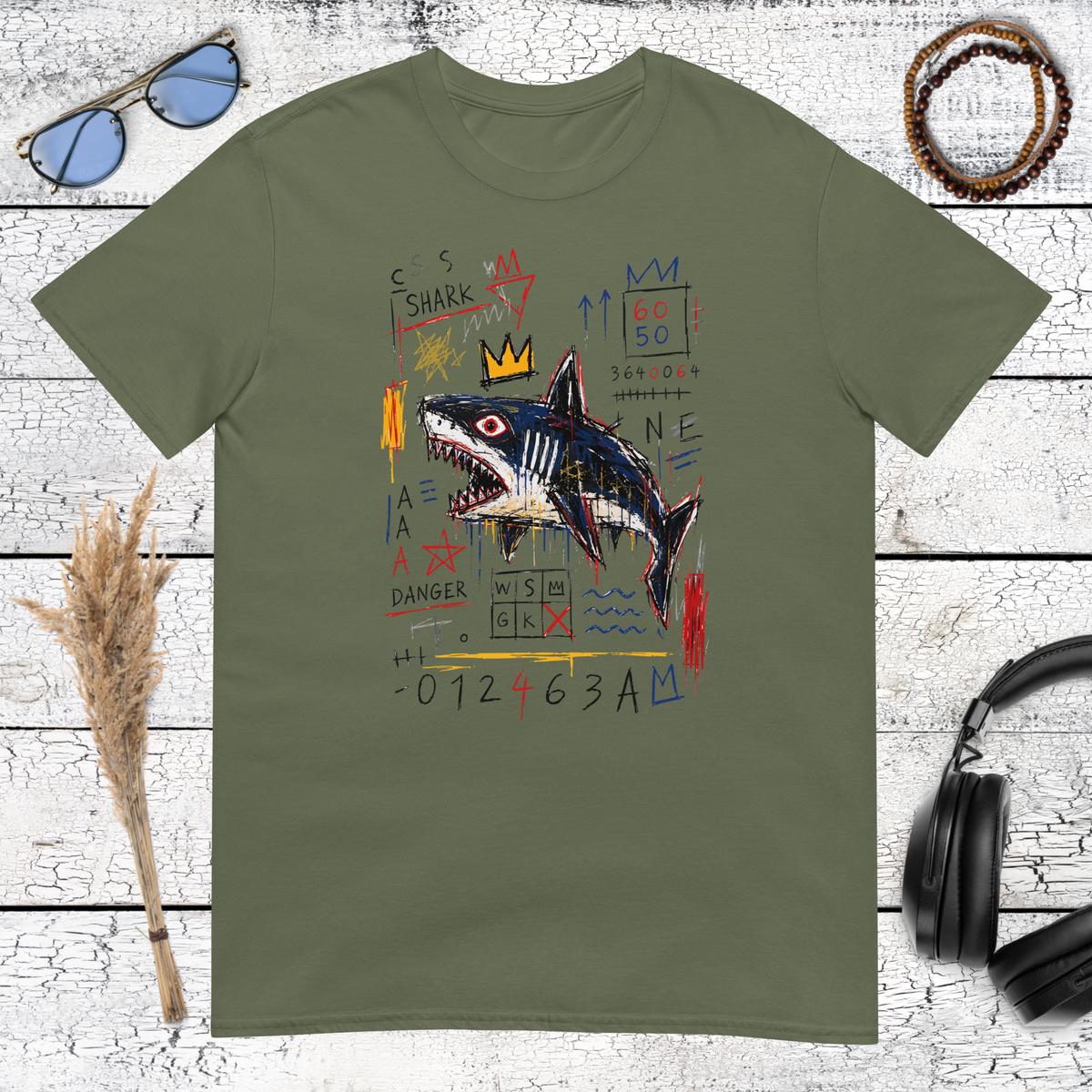 Creative crowned shark graphic with neo-expressionist street art details on a military green t-shirt