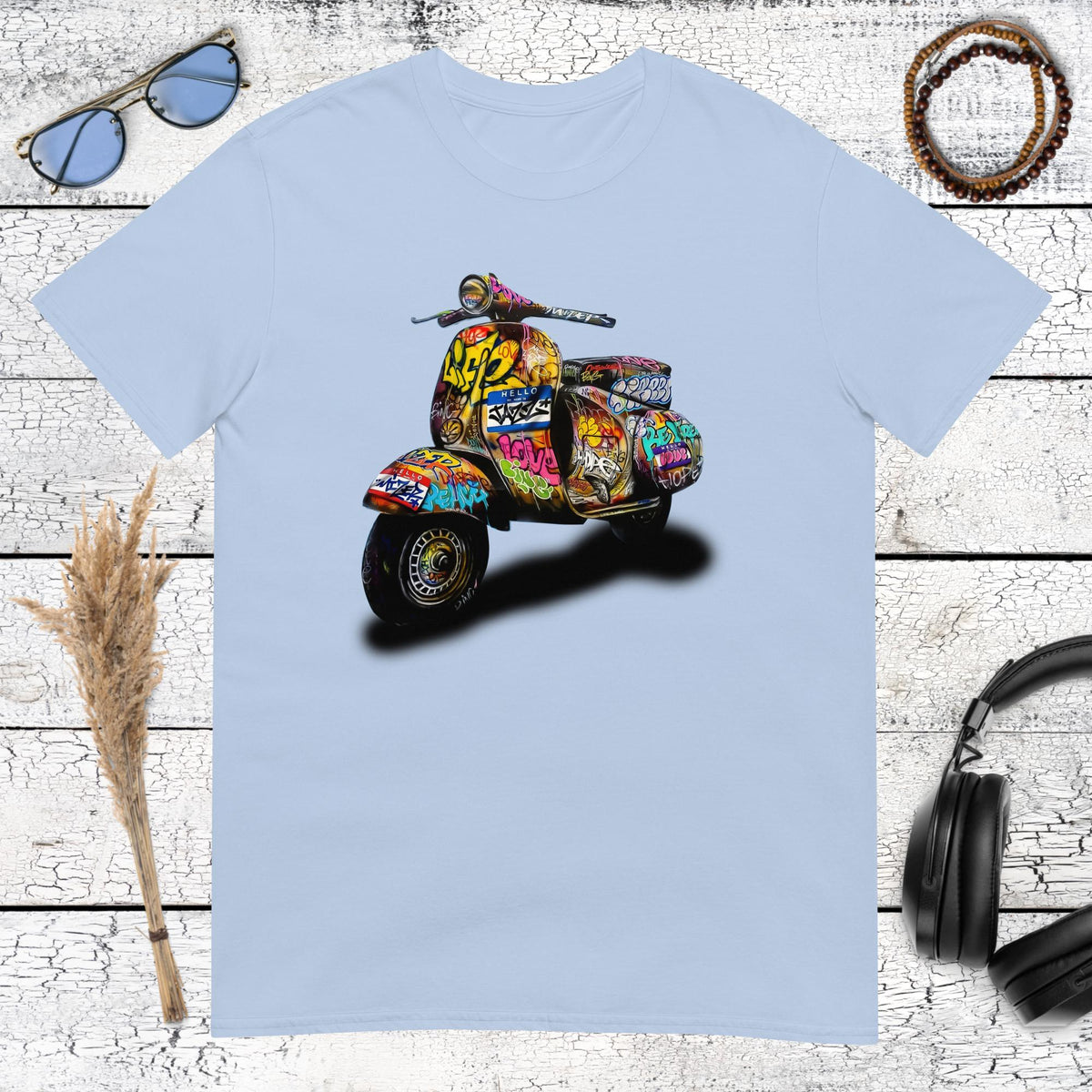 Retro Vespa scooter graphic with colourful graffiti details printed on a light blue t-shirt