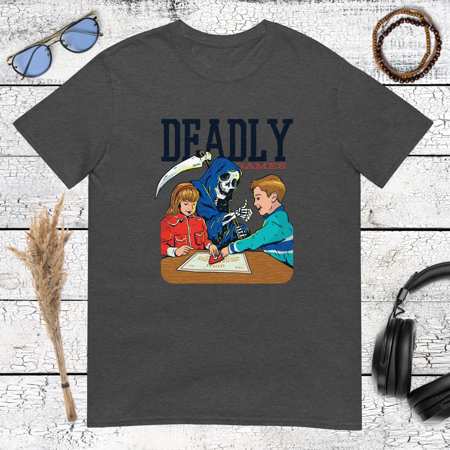 High contrast dark humor graphic of the Reaper playing console games on a dark heather grey t-shirt