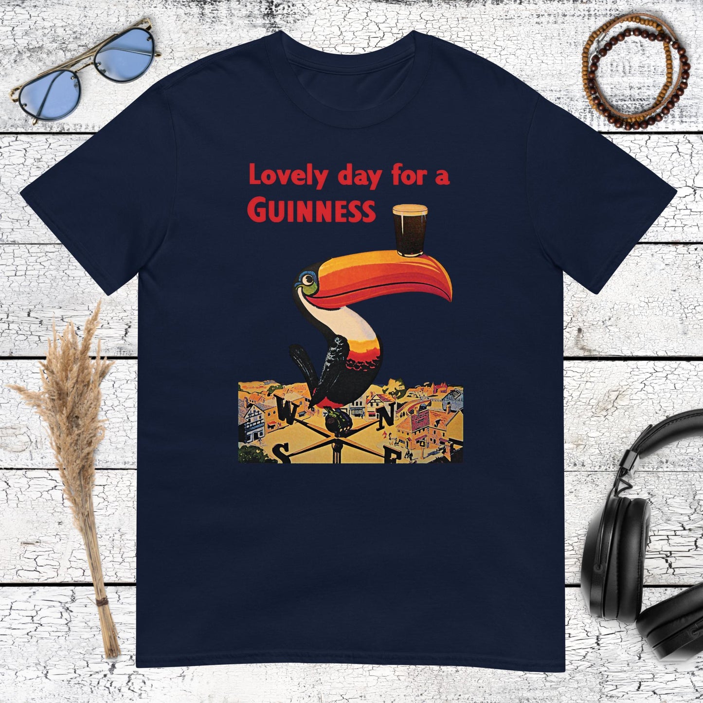Classic Guinness poster style toucan with Lovely day for a Guinness text on a navy t-shirt
