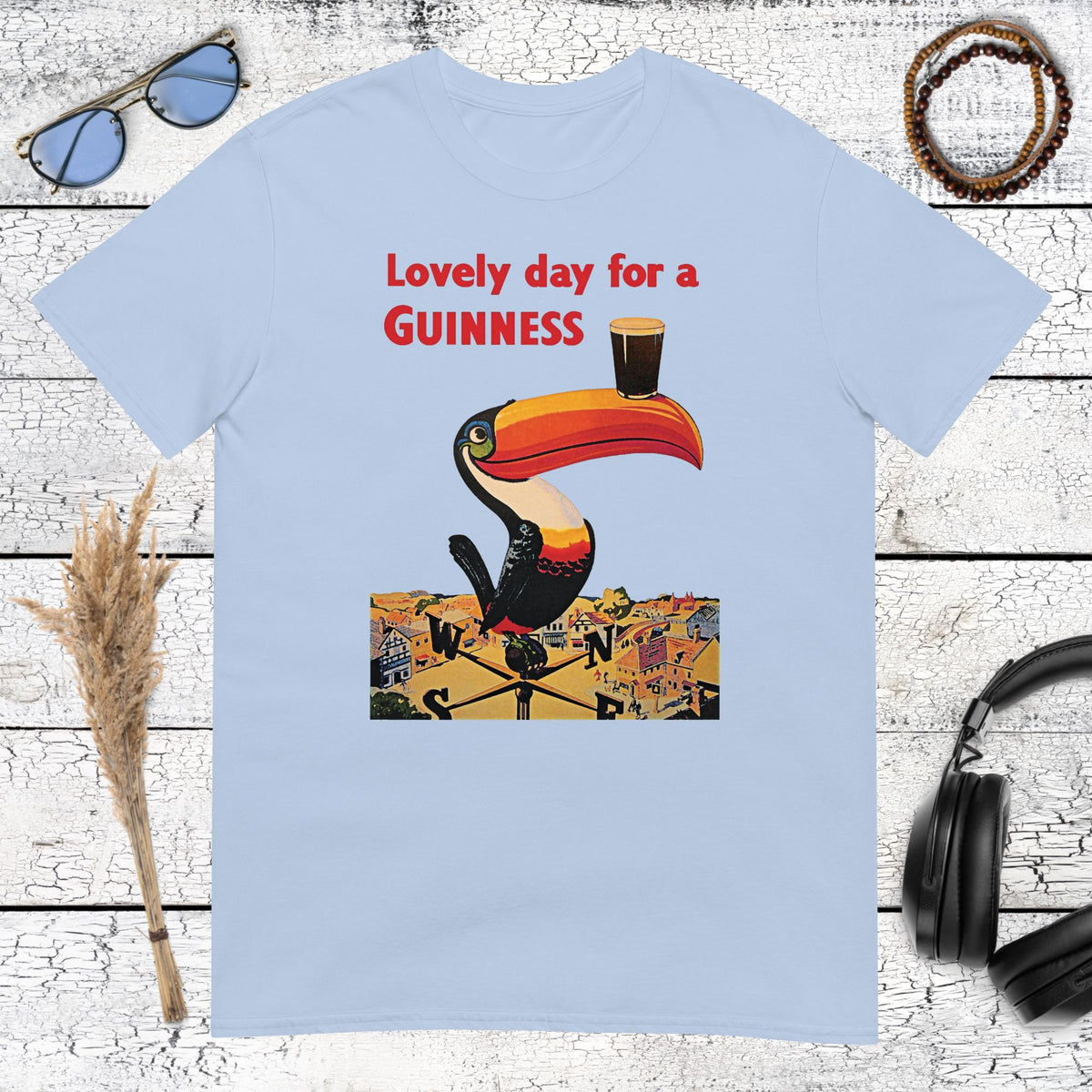 Colorful vintage Guinness toucan beer illustration with Guinness branding on a light blue t-shirt