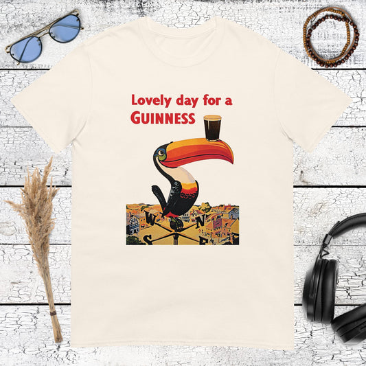 Vintage Guinness advertising toucan carrying a Guinness beer glass on a natural t-shirt