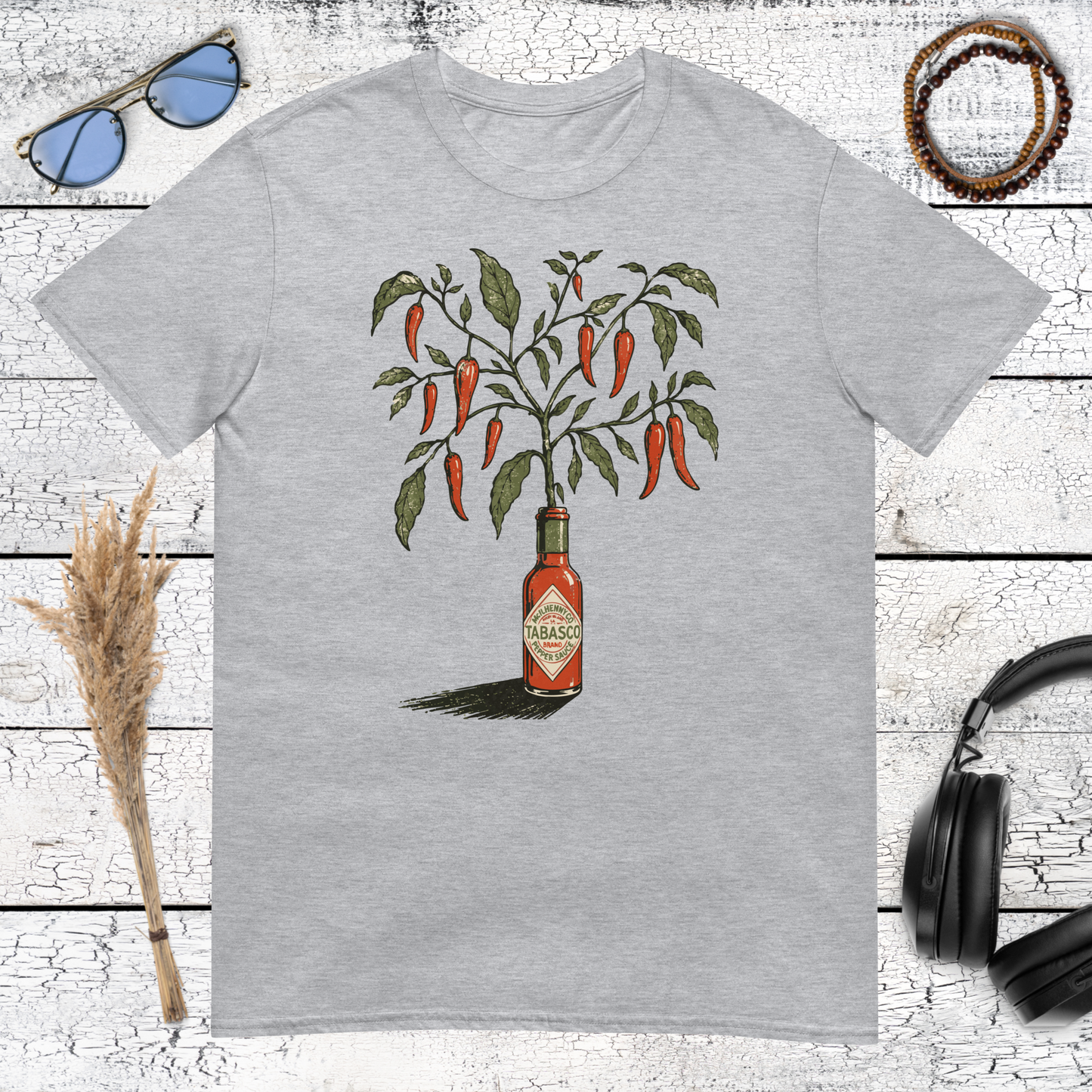 Vintage hot sauce bottle growing into a chili pepper plant printed on a sport grey t-shirt