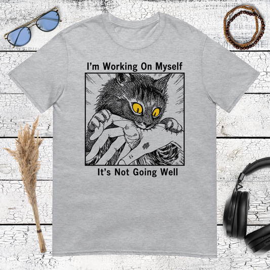 Black and white cat illustration with I’m Working On Myself It’s Not Going Well text on a sport grey t-shirt