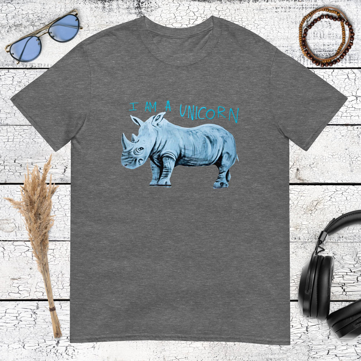 Humorous illustration of a rhino with "I'm a unicorn" text on a dark heather grey t-shirt