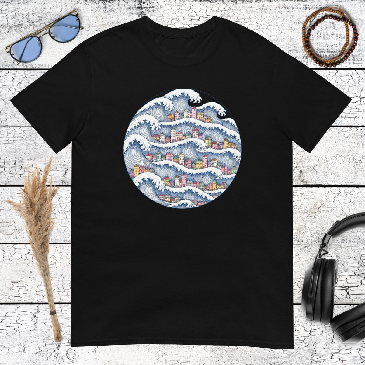 Coastal wave village artwork with Japanese-inspired details printed on a black t-shirt