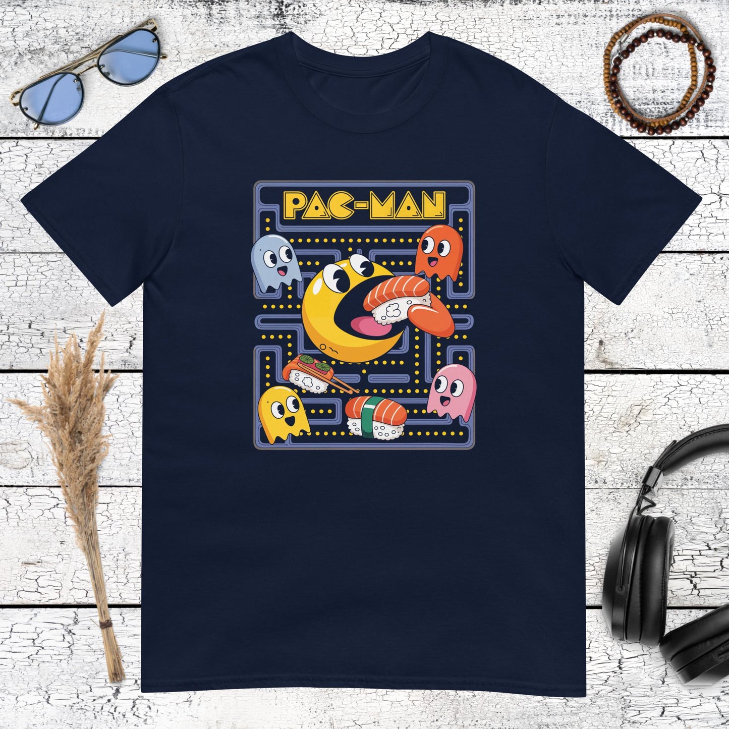 Fun pixel-style sushi and arcade graphic on a navy blue t-shirt