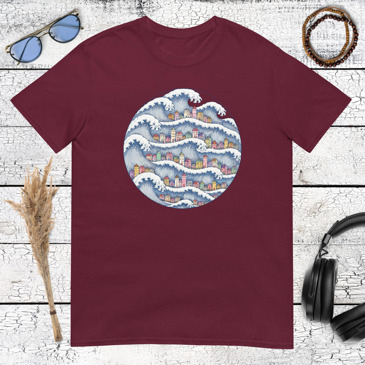 Coastal wave village artwork with Japanese-inspired details printed on a maroon t-shirt