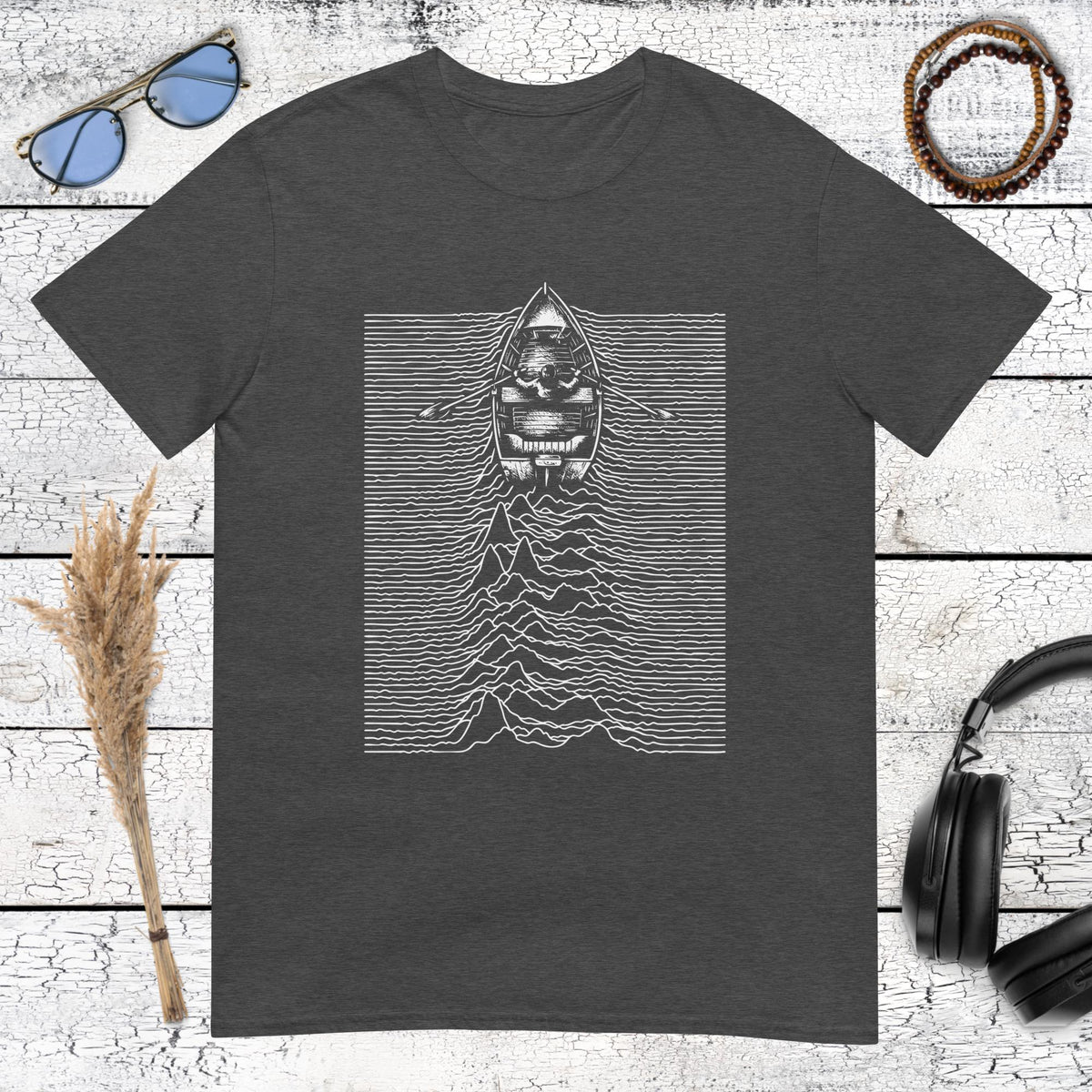 Monochrome boat and waveform artwork on a dark heather grey t-shirt