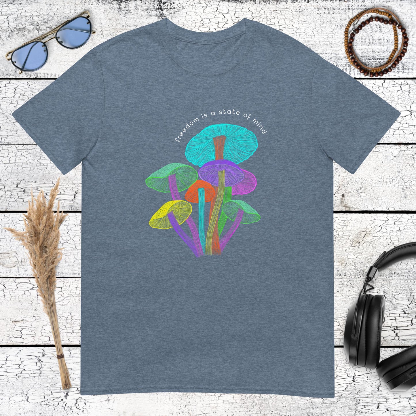Dreamy heather indigo t-shirt featuring vibrant glowing mushrooms and a philosophical freedom quote
