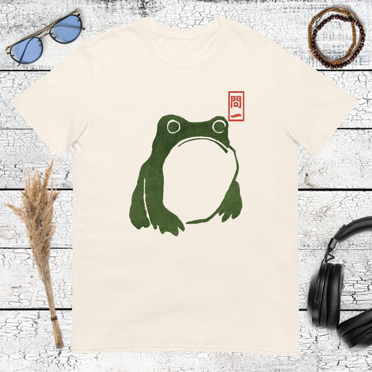 Green Japanese frog art with a red stamp detail printed on a natural cotton t-shirt