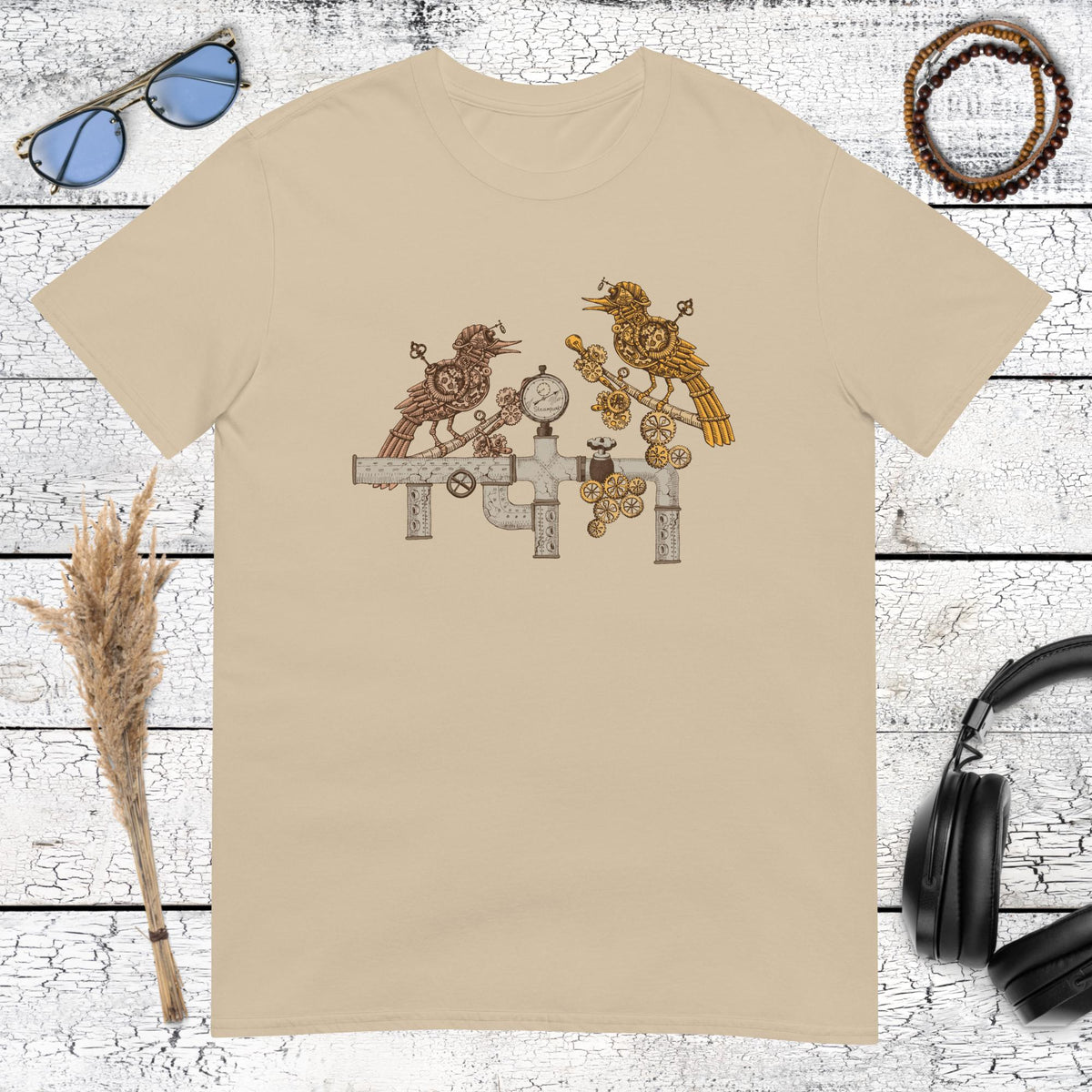 Steampunk bird graphic with vintage mechanical details printed on a sand t-shirt