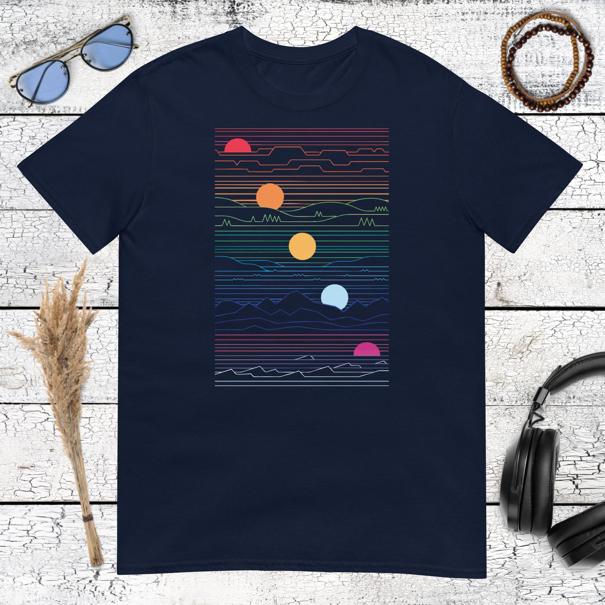 Abstract sun and horizontal lines graphic art on a navy blue tee
