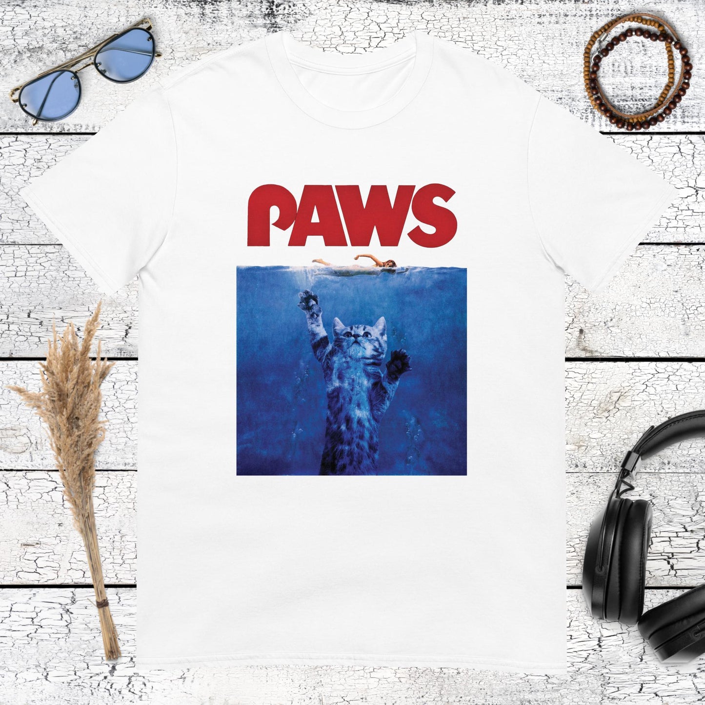 PAWS graphic with cat and shark movie poster style artwork on a white t-shirt
