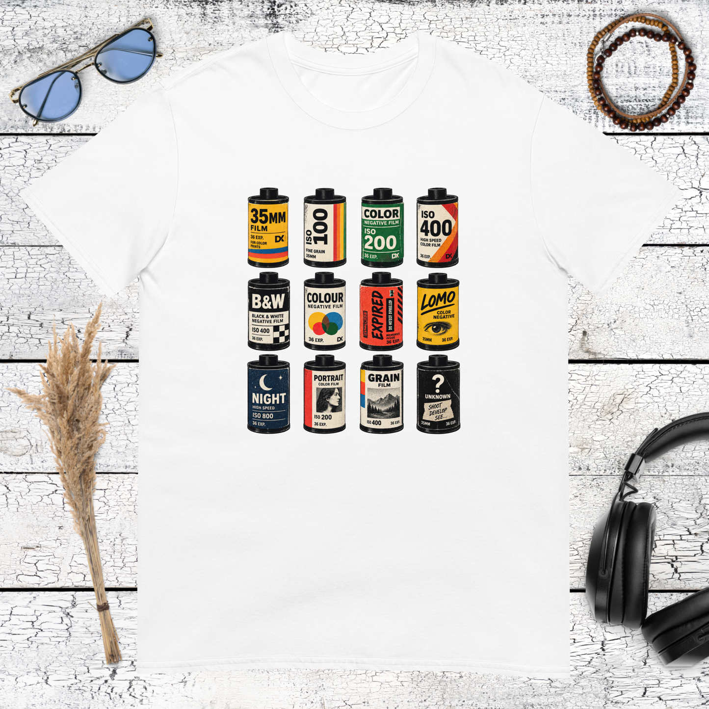 Colourful film canister and photography graphic printed on a white t-shirt